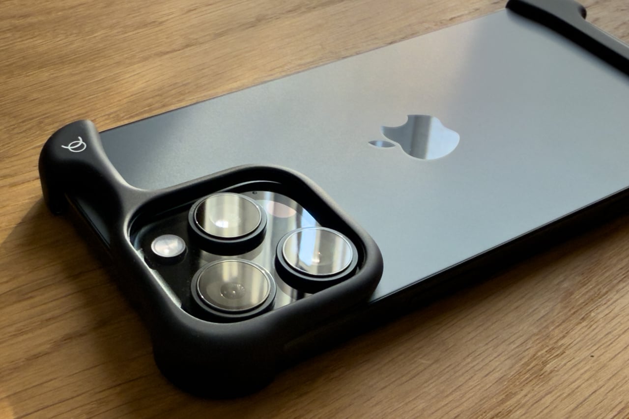 Raised Arc Pulse shell framing the iPhone camera lenses - Luxe Digital