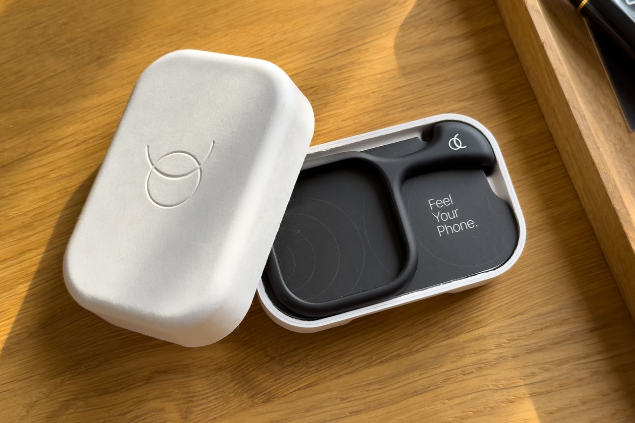 Arc Pulse box opened to show the Feel Your Phone insert - Luxe Digital