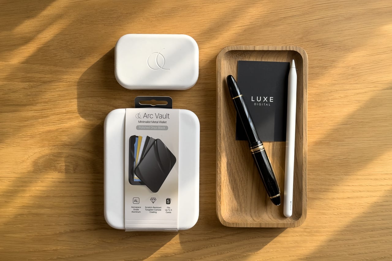 Arc Vault box and the small white Arc Pulse box beside a wooden desk tray - Luxe Digital