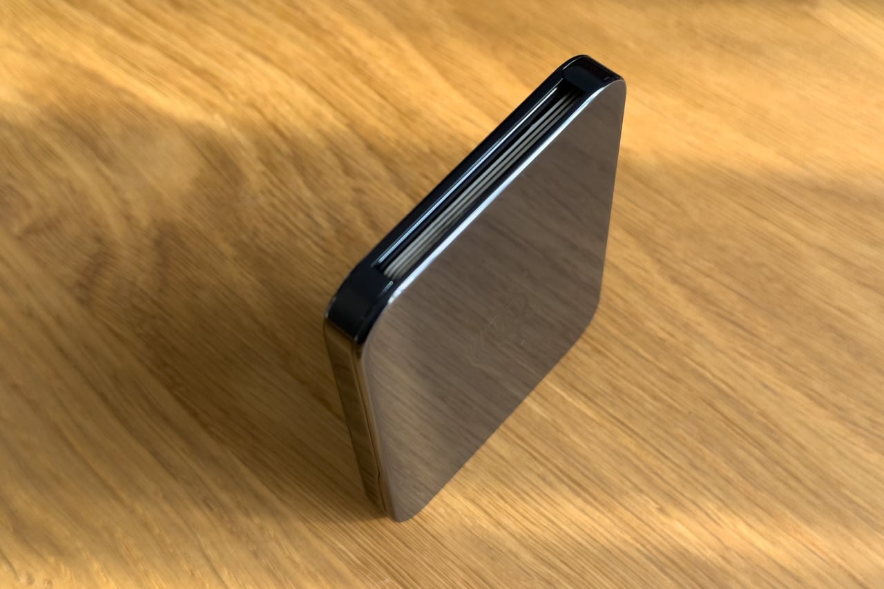 Arc Vault in Onyx Black standing on its edge to show its slim profile - Luxe Digital