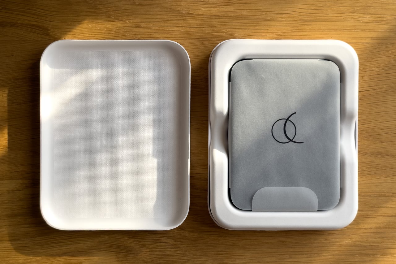 Arc Vault box opened to show the wallet under a grey cloth - Luxe Digital
