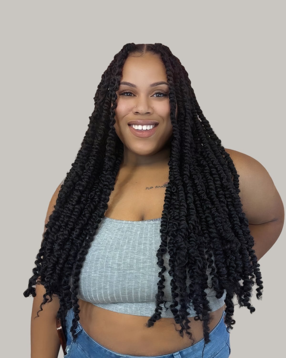 Smiling woman with long passion twists past her waist