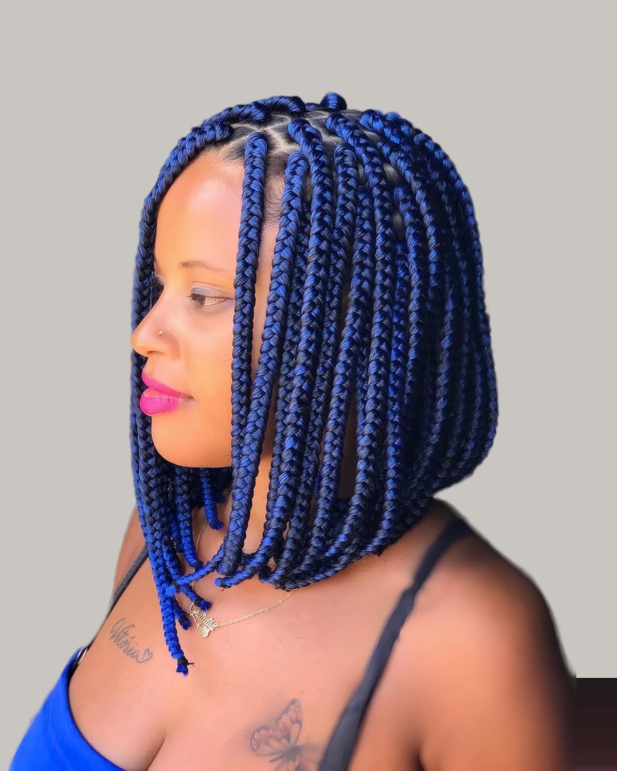 Woman in profile with a blue braided bob