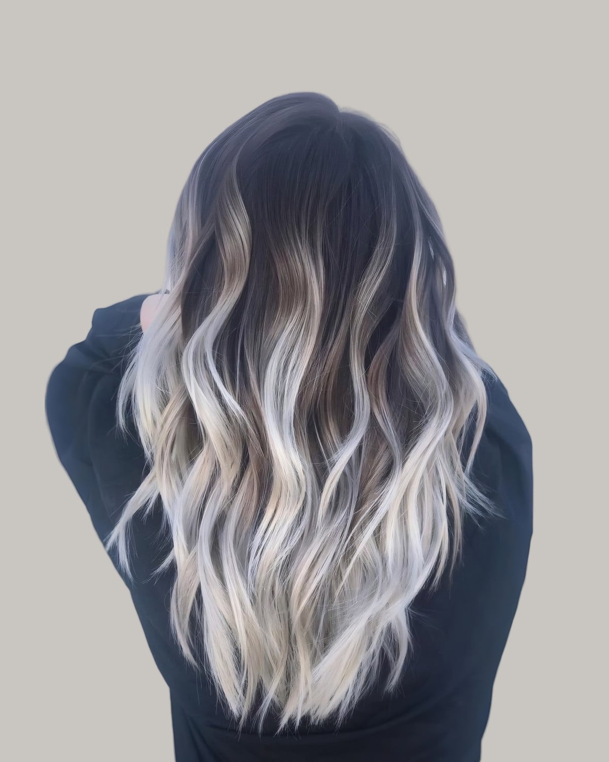 Back view of a black root and platinum waves