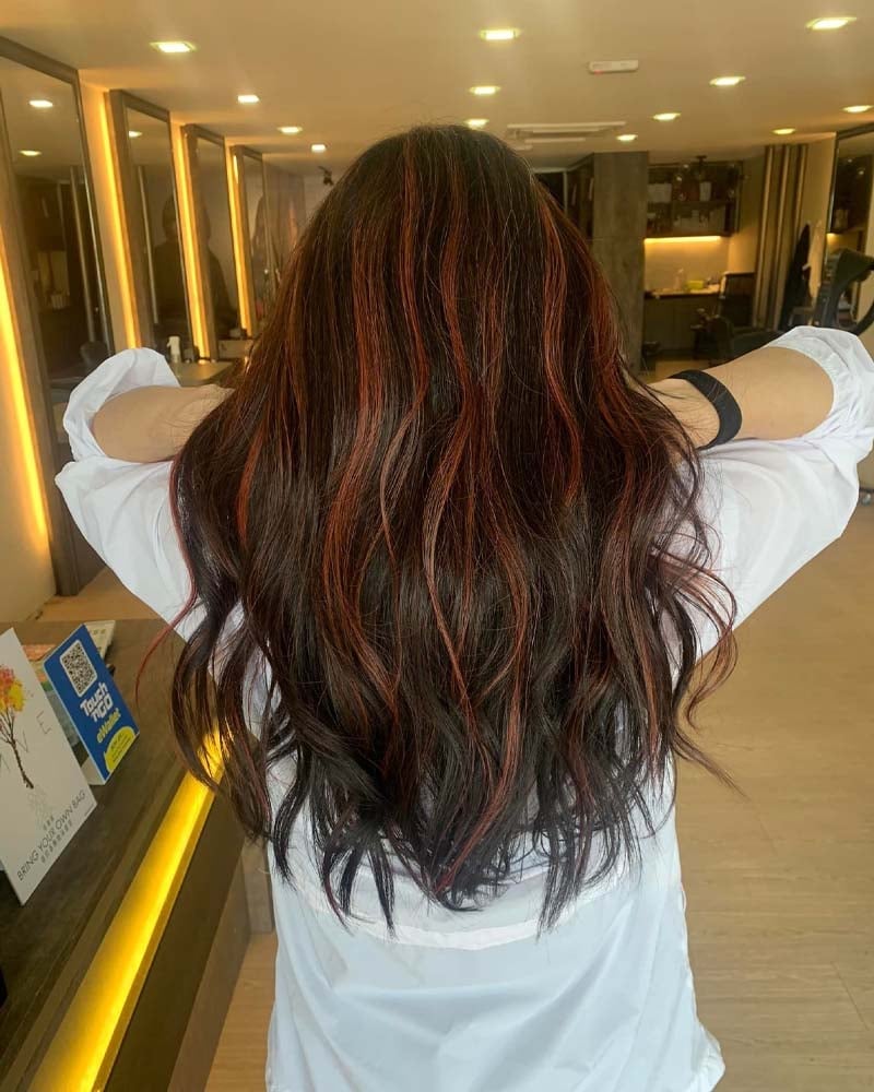 black hair with pastel red highlights - Luxe Digital