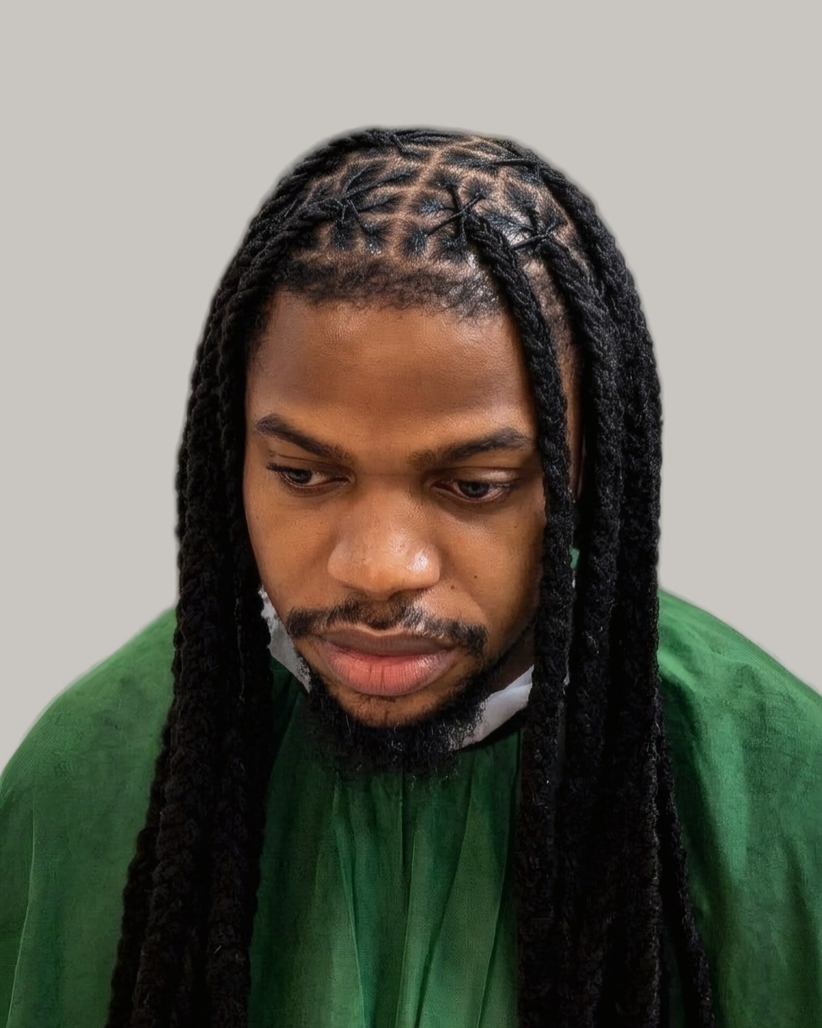 Bearded man with long braids, seen from the front