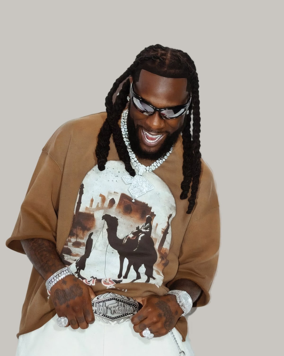 Man in sunglasses with long box braids, seen from the front