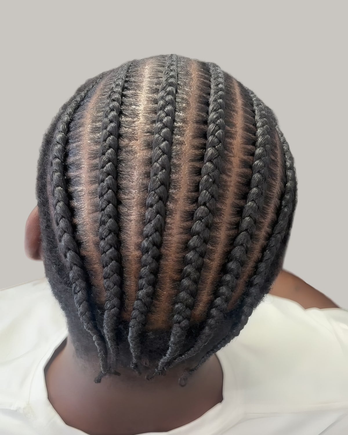 Straight-back cornrows seen from behind