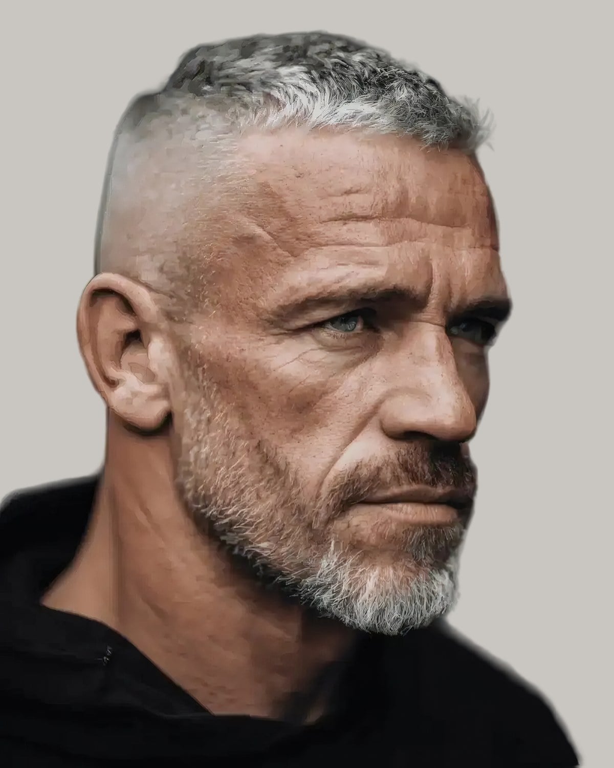 Man with a short buzz cut and a grey-flecked beard, seen in profile
