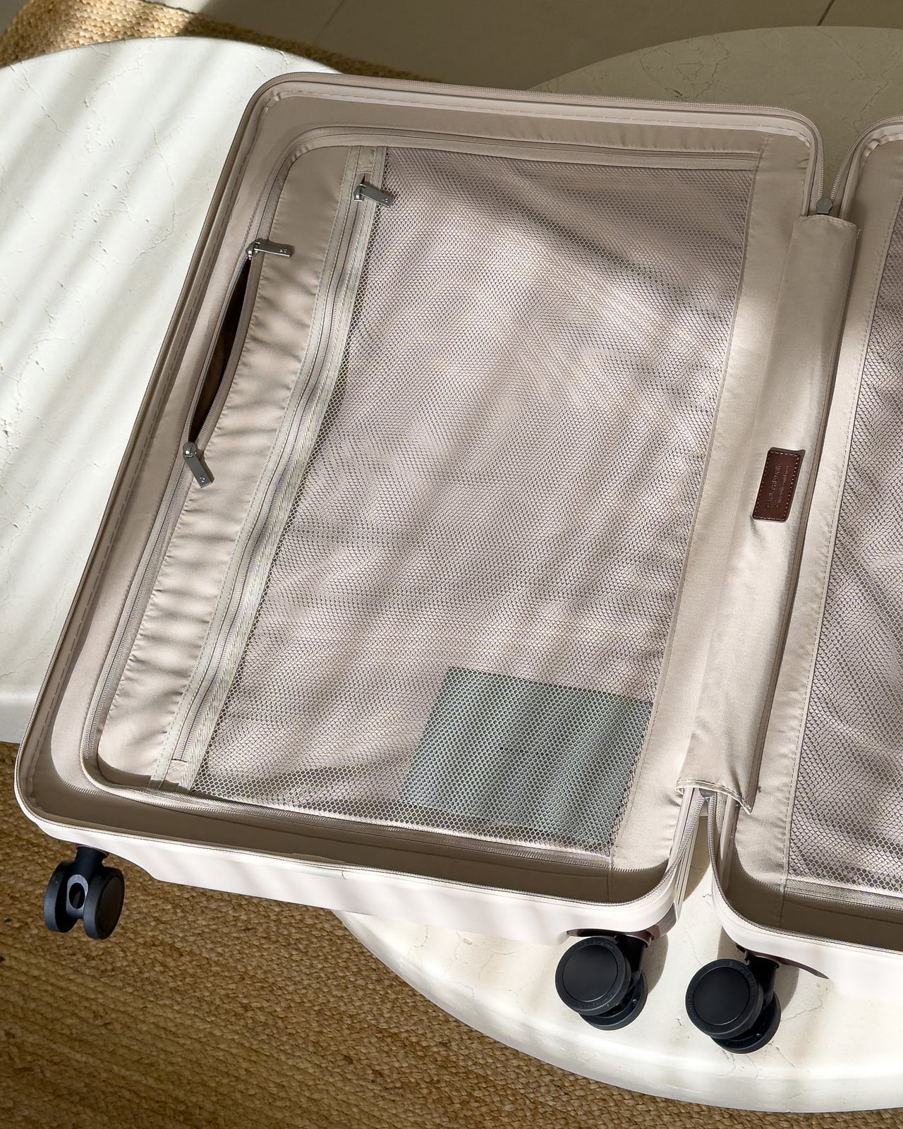 One zipped half of the Carl Friedrik suitcase with a mesh panel and side pocket - Luxe Digital