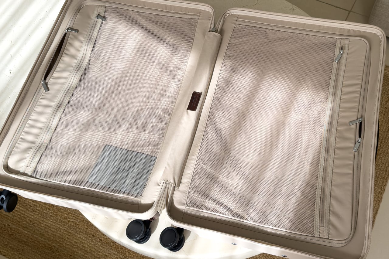 Carl Friedrik Core Check-In Large opened flat to show two zipped mesh compartments - Luxe Digital