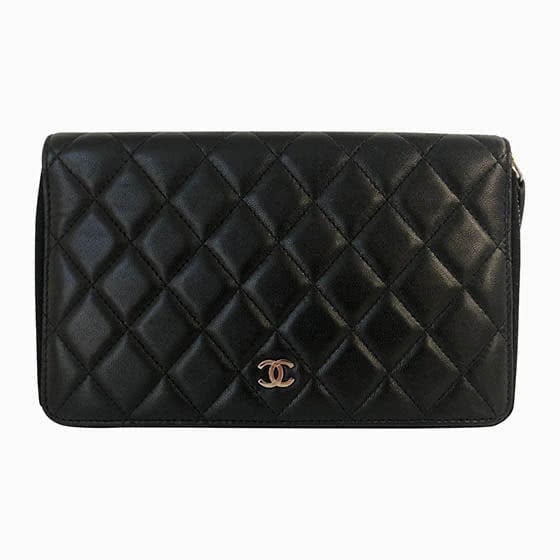 Chanel black leather clutch best luxury brands - Luxe Digital