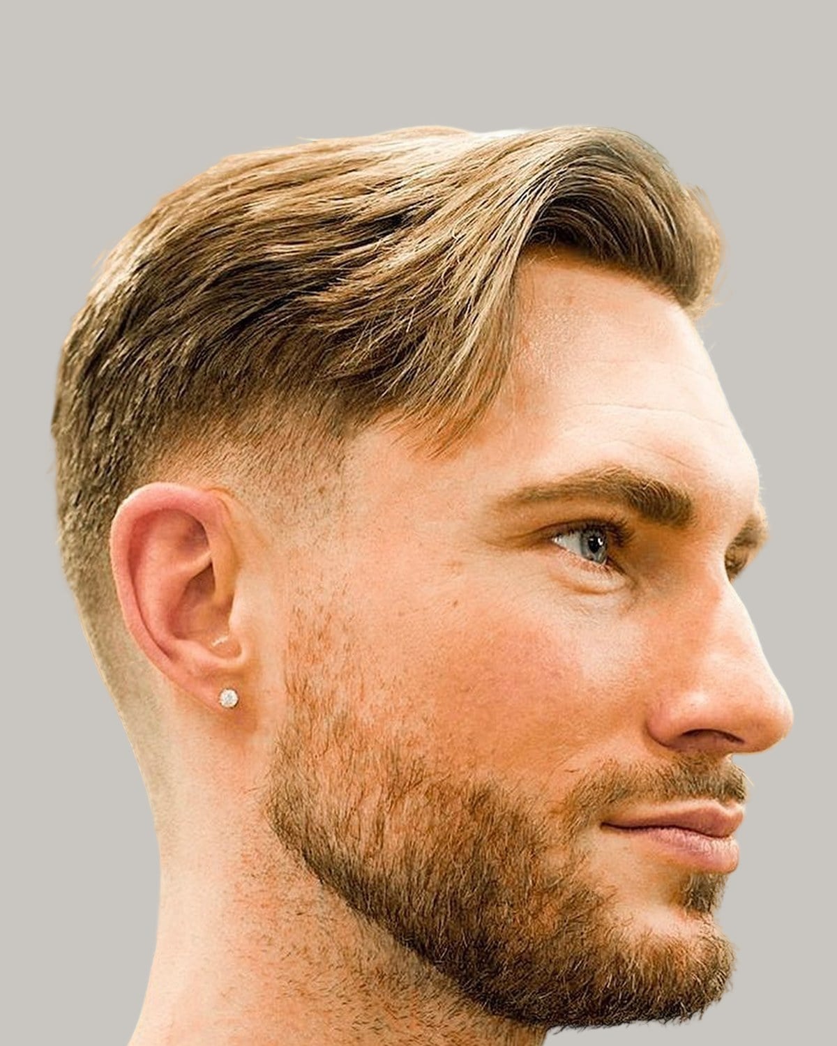 Bearded man with an Ivy League haircut, seen in profile