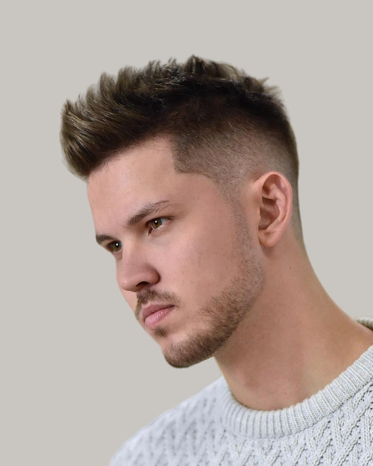 Man with a short textured crew cut, seen at an angle