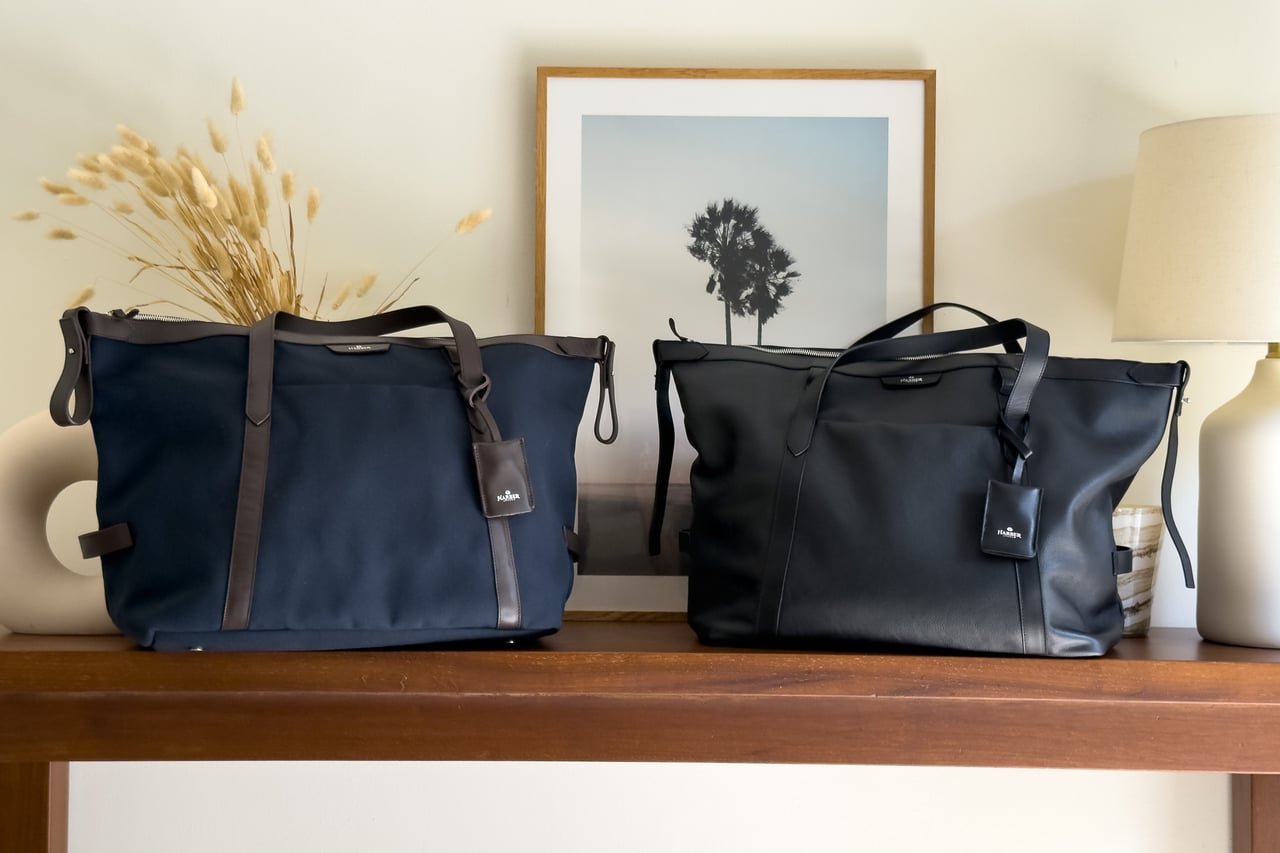 Harber London recycled-fabric Overnight Bag in Navy Blue next to the black leather version - Luxe Digital