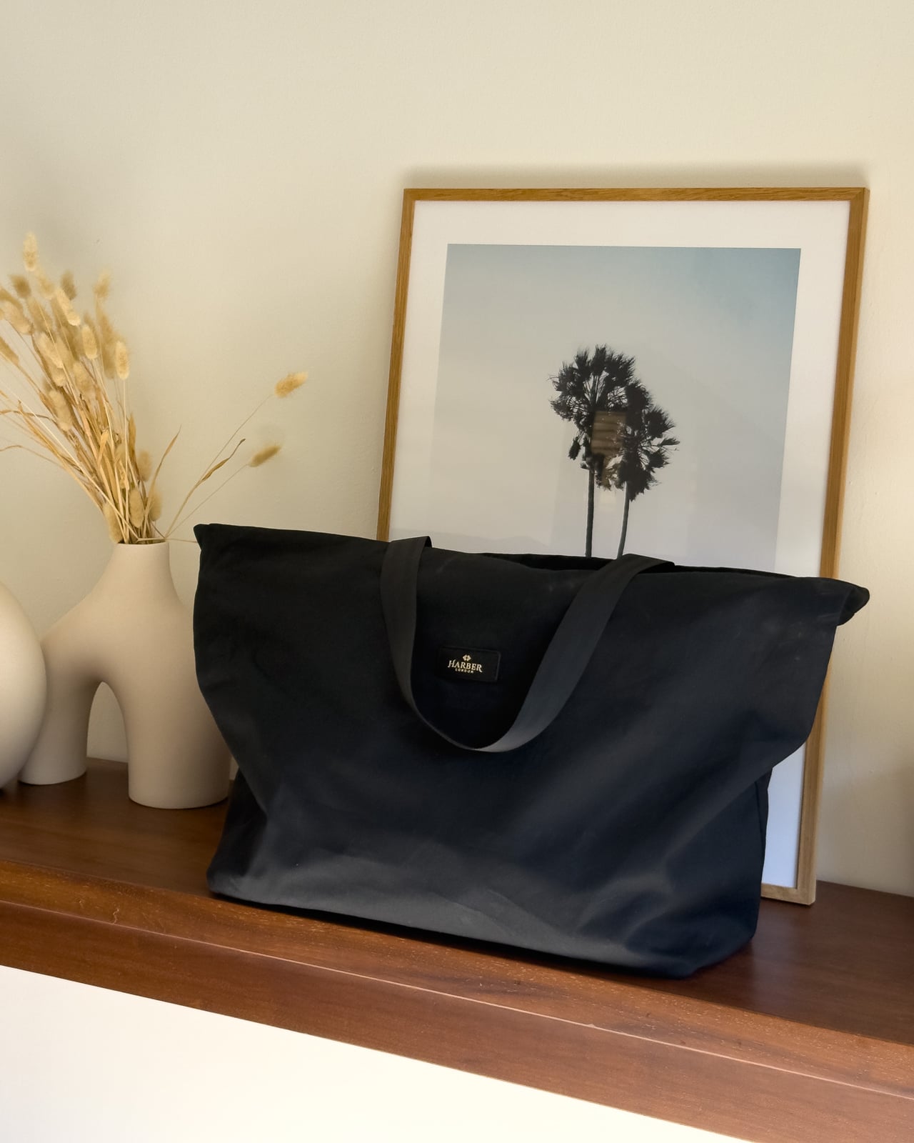Harber London branded black canvas tote that the Overnight Bag is delivered in - Luxe Digital