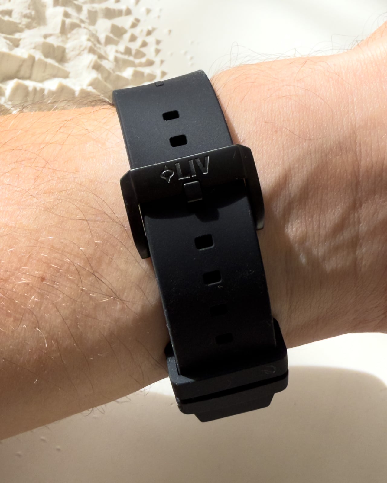 LIV Gravel black rubber strap and buckle worn on the wrist - Luxe Digital