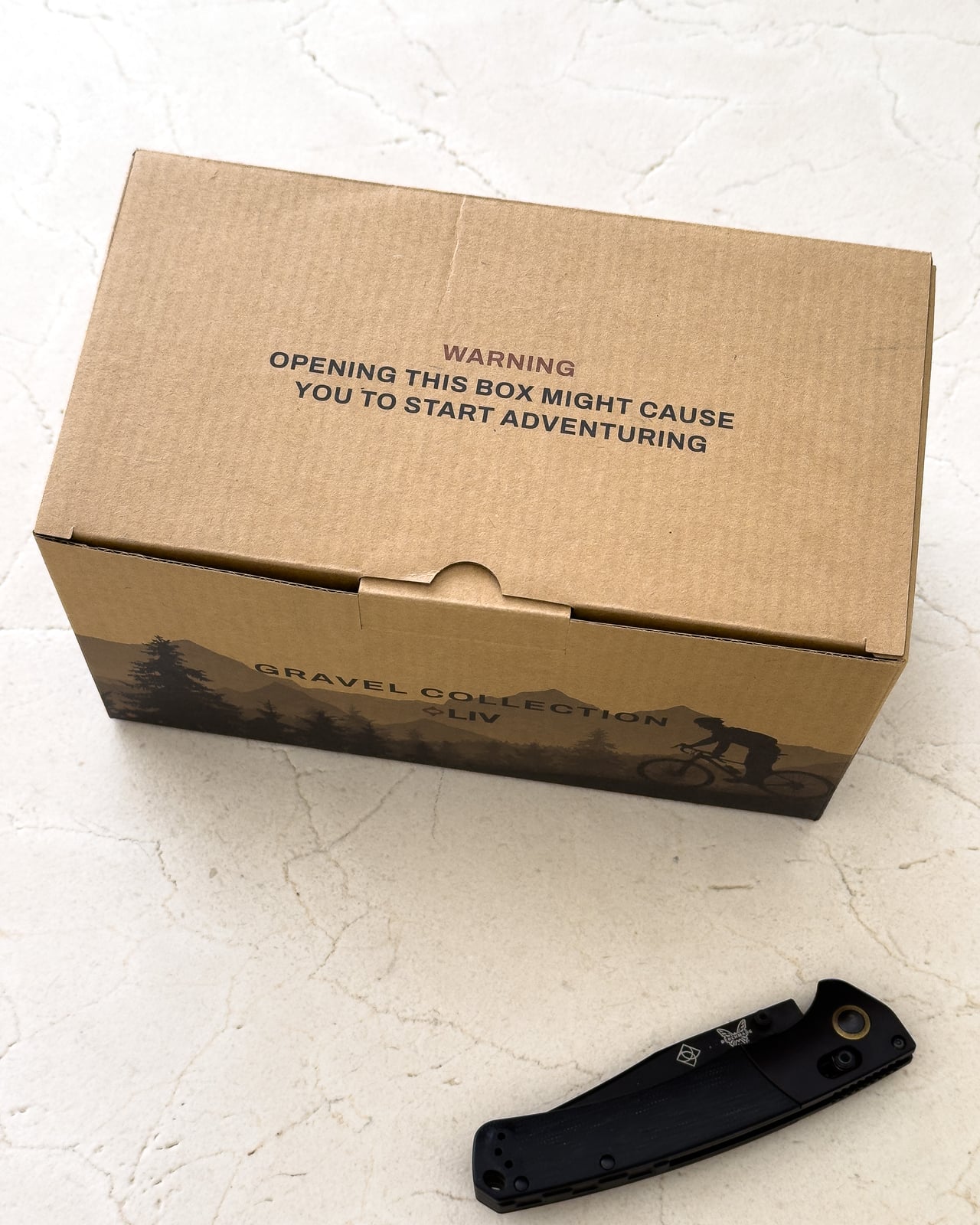 LIV Gravel collection delivery box with its adventure warning printed on the lid - Luxe Digital