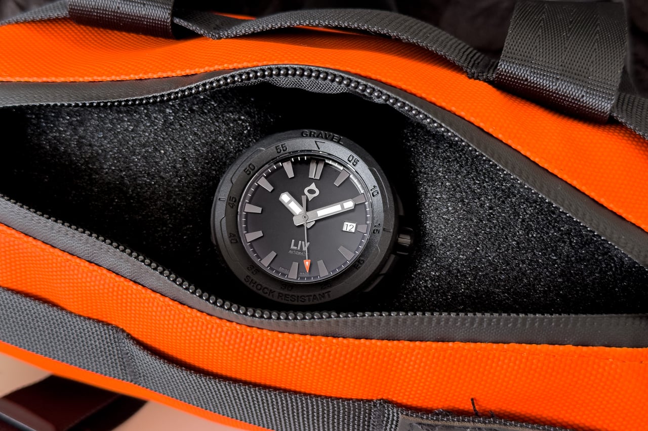 LIV Gravel Stealth Auto watch unboxed inside its orange bike bag - Luxe Digital