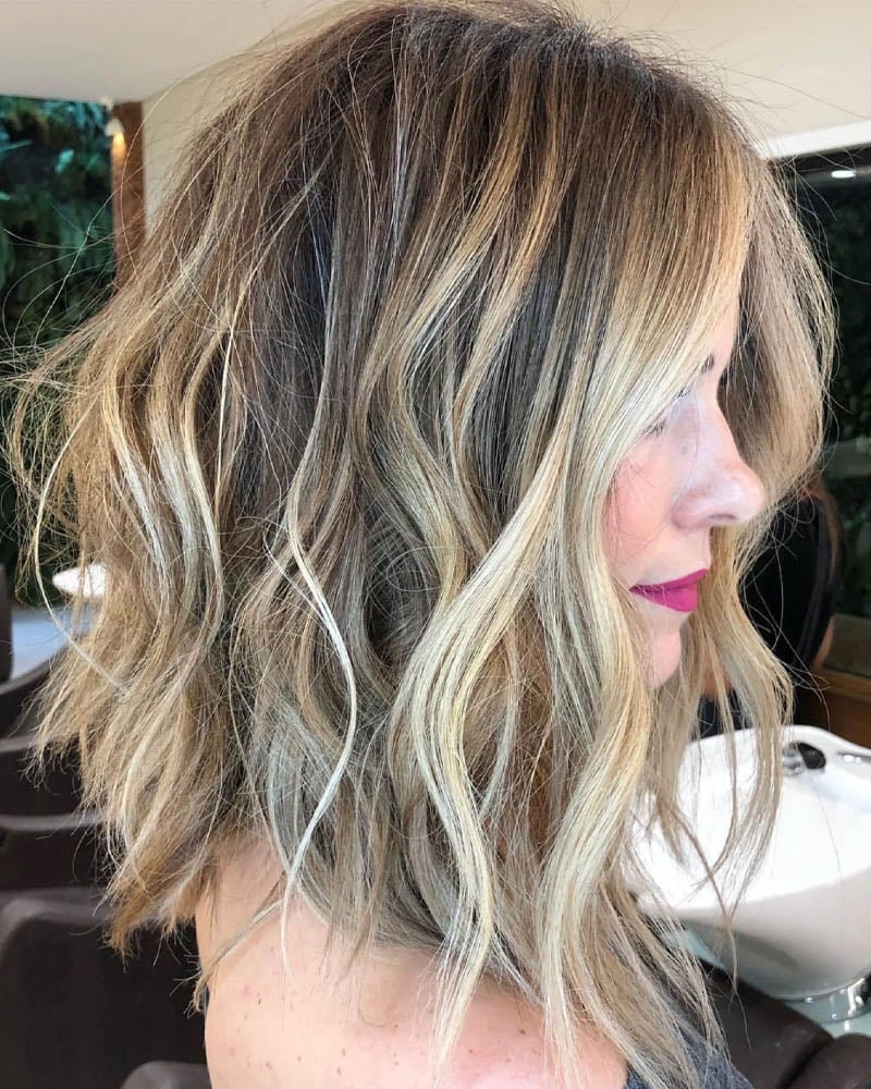 medium length hairstyles women messy wavy lob with disconnected ends Luxe Digital