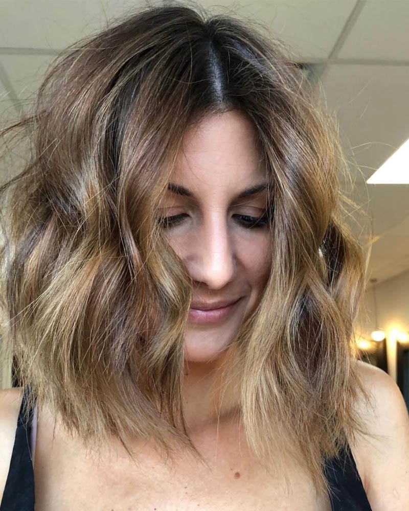 medium length hairstyles women messy wavy lob with disconnected ends Luxe Digital