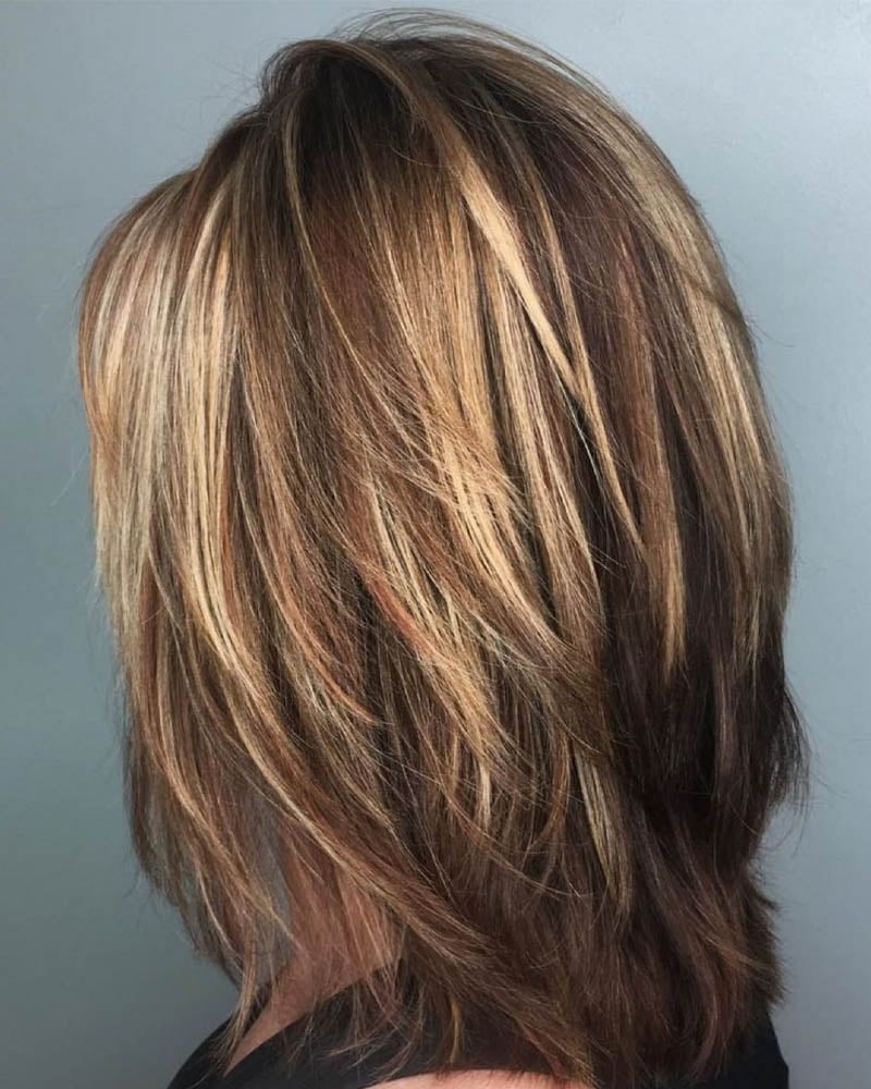 medium length hairstyles women one length medium cut with feathered layers Luxe Digital