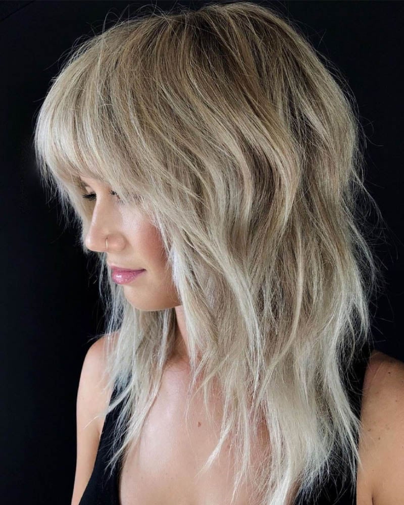 medium length hairstyles women shattered blonde shag with flyaways Luxe Digital