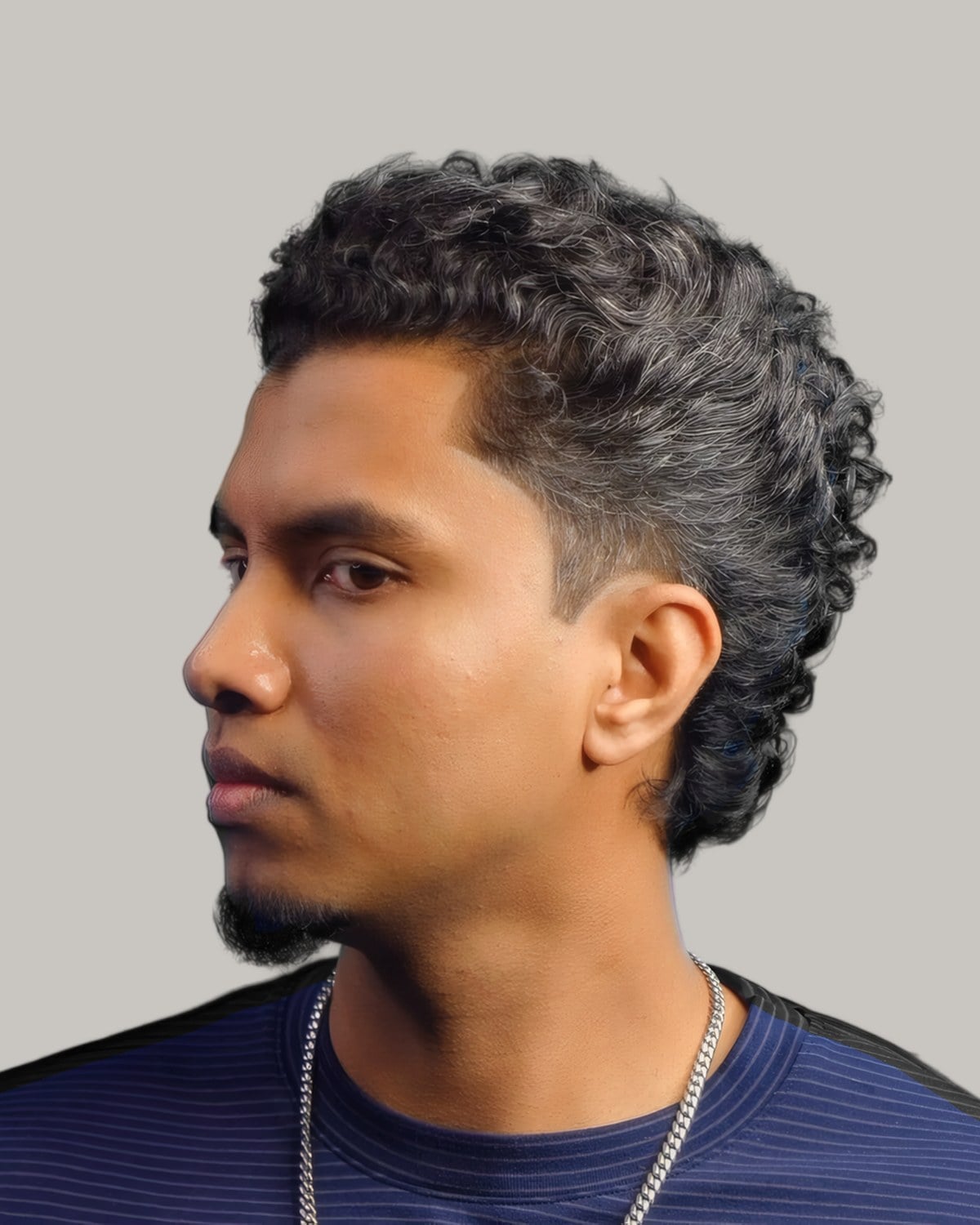 Man with a wavy textured top and a gradual fade, seen from the side