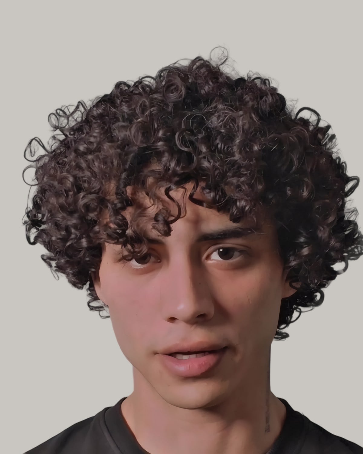 Young man with a mass of tight curls reaching past the ears, seen from the front