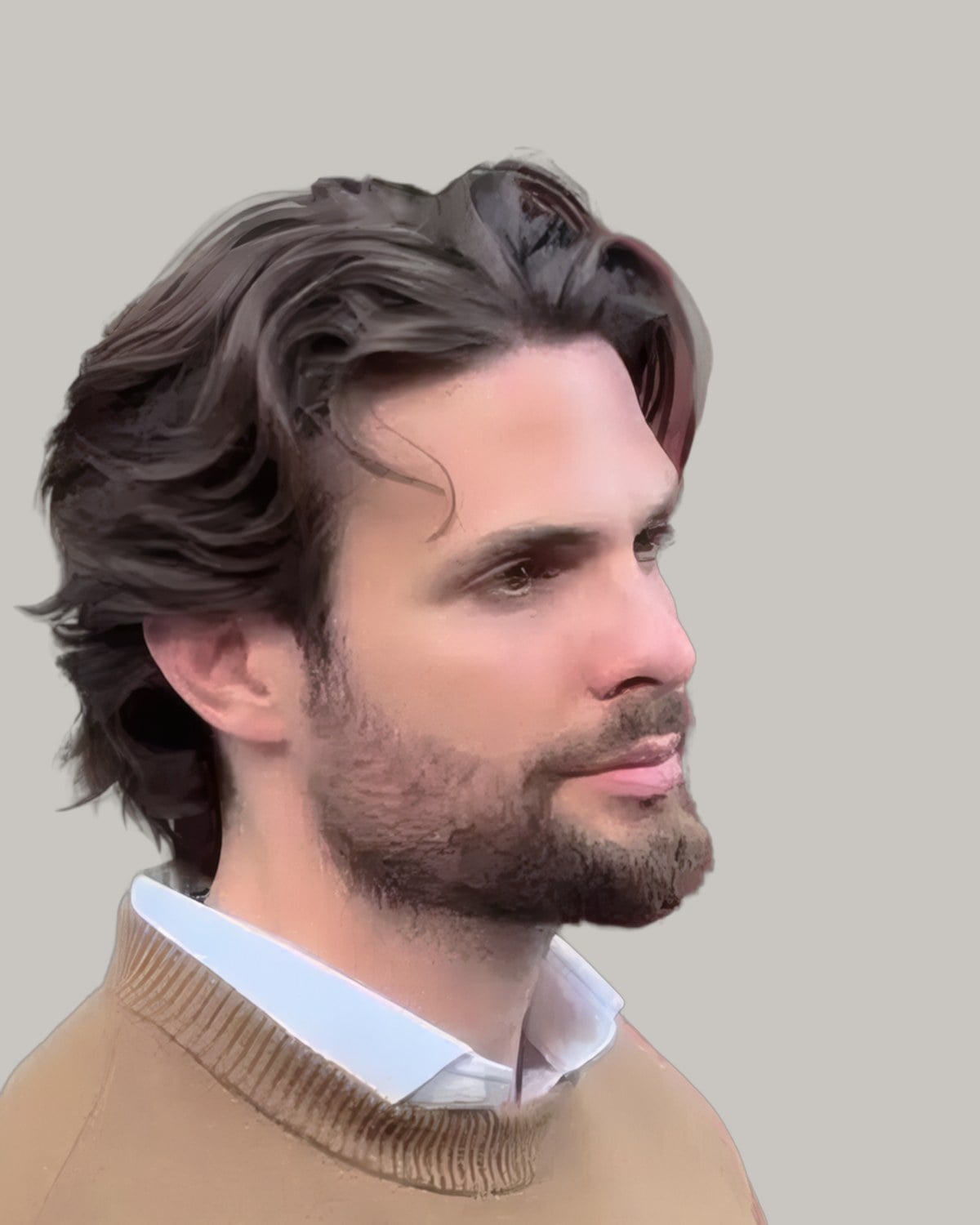 Bearded man with dark wavy hair swept back to the collar, in a camel sweater