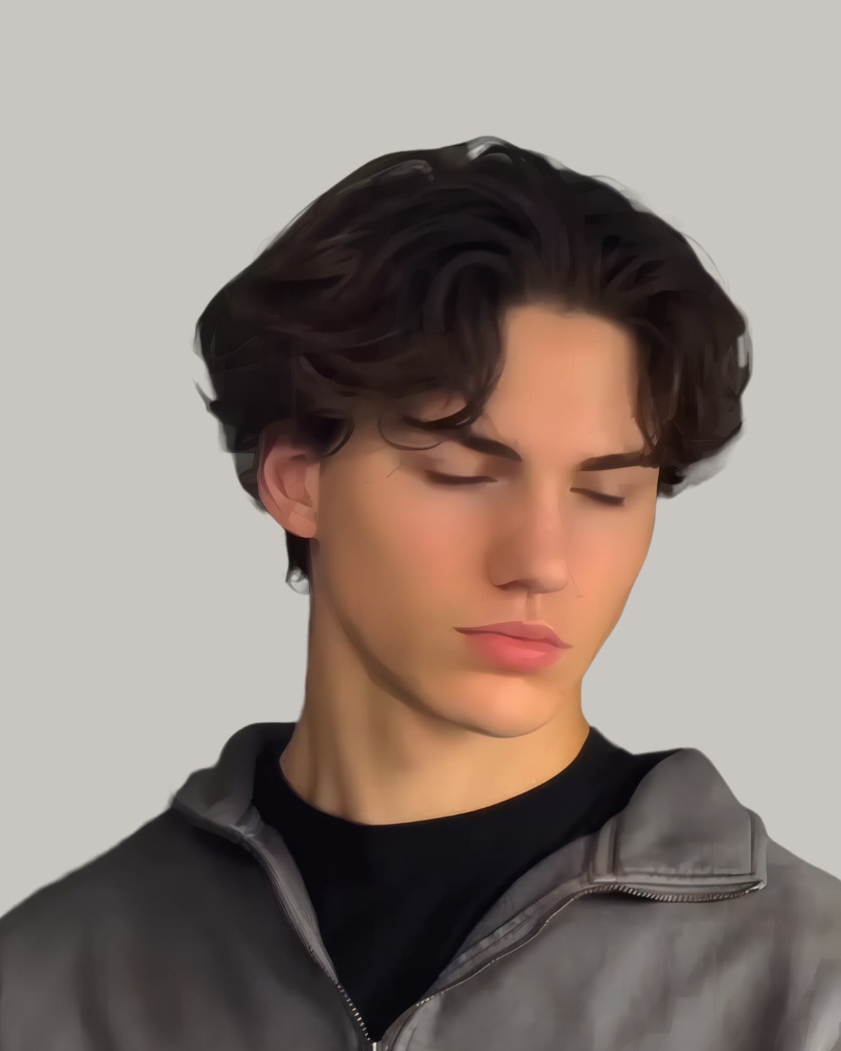 Young man with dark wavy hair parted in the middle, falling to his eyebrows, in a grey zip top