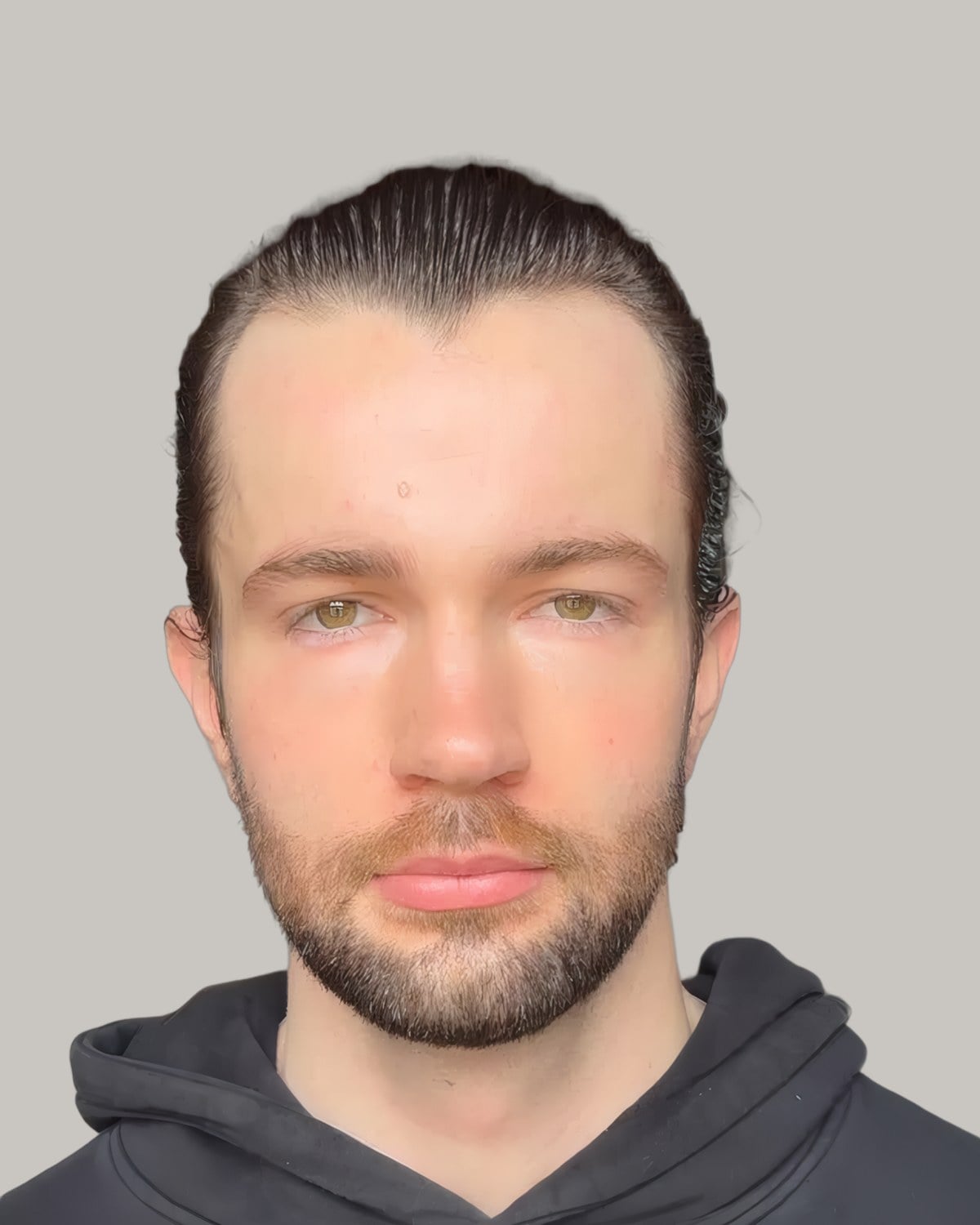 Man with dark hair slicked straight back and a short beard, in a black hoodie
