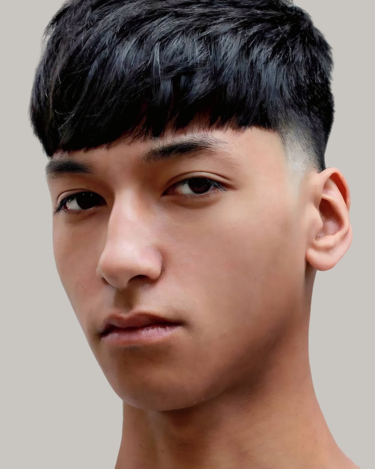 Young man with an Edgar haircut, facing the camera