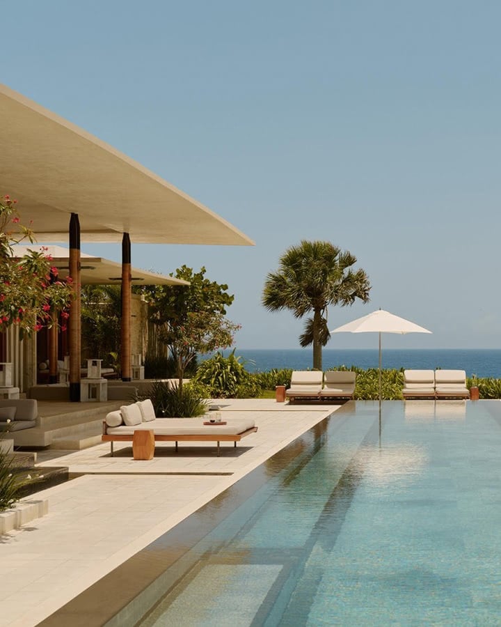 An infinity pool overlooking the sea at a luxury resort