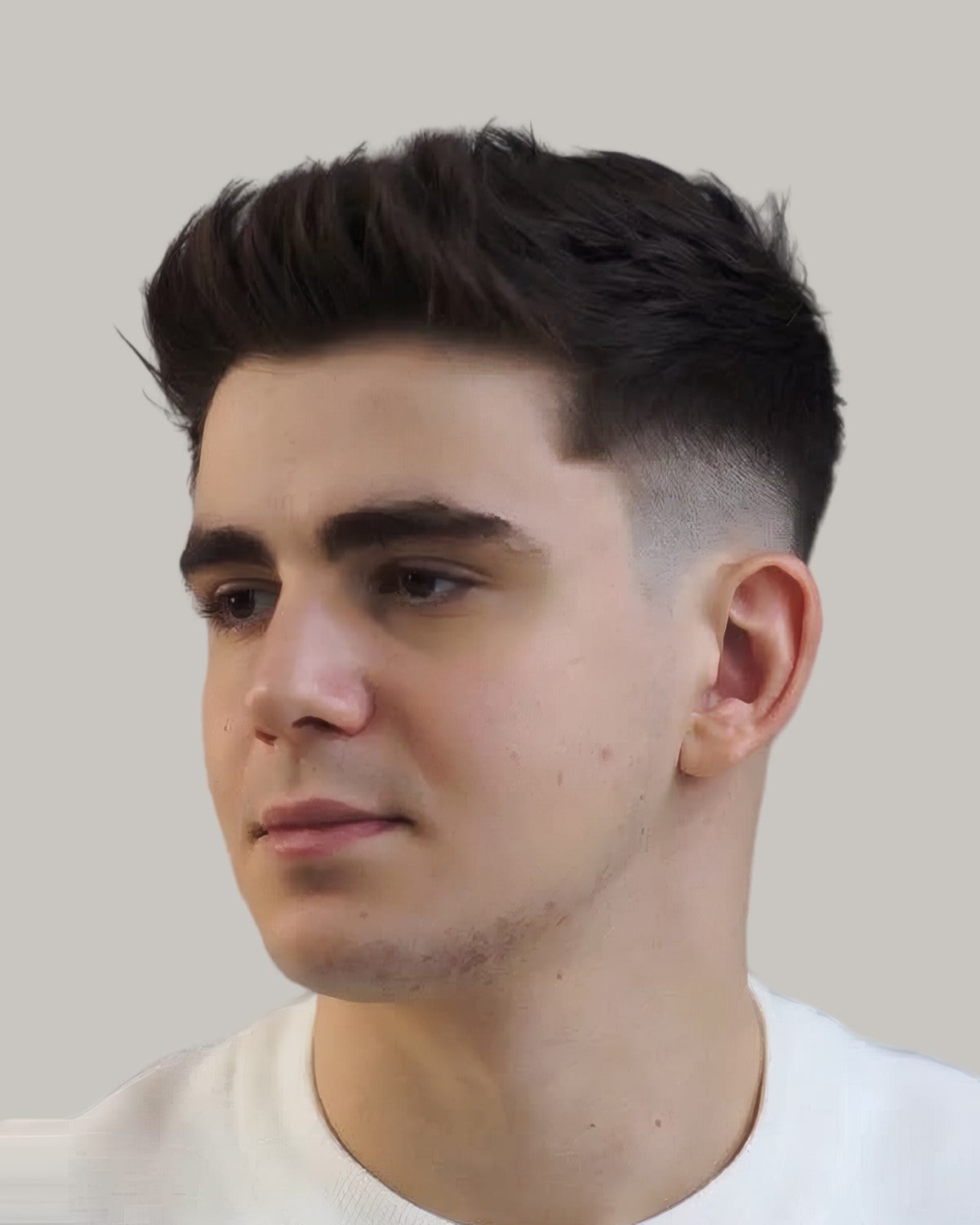 Young man with a quiff and a taper, seen at an angle