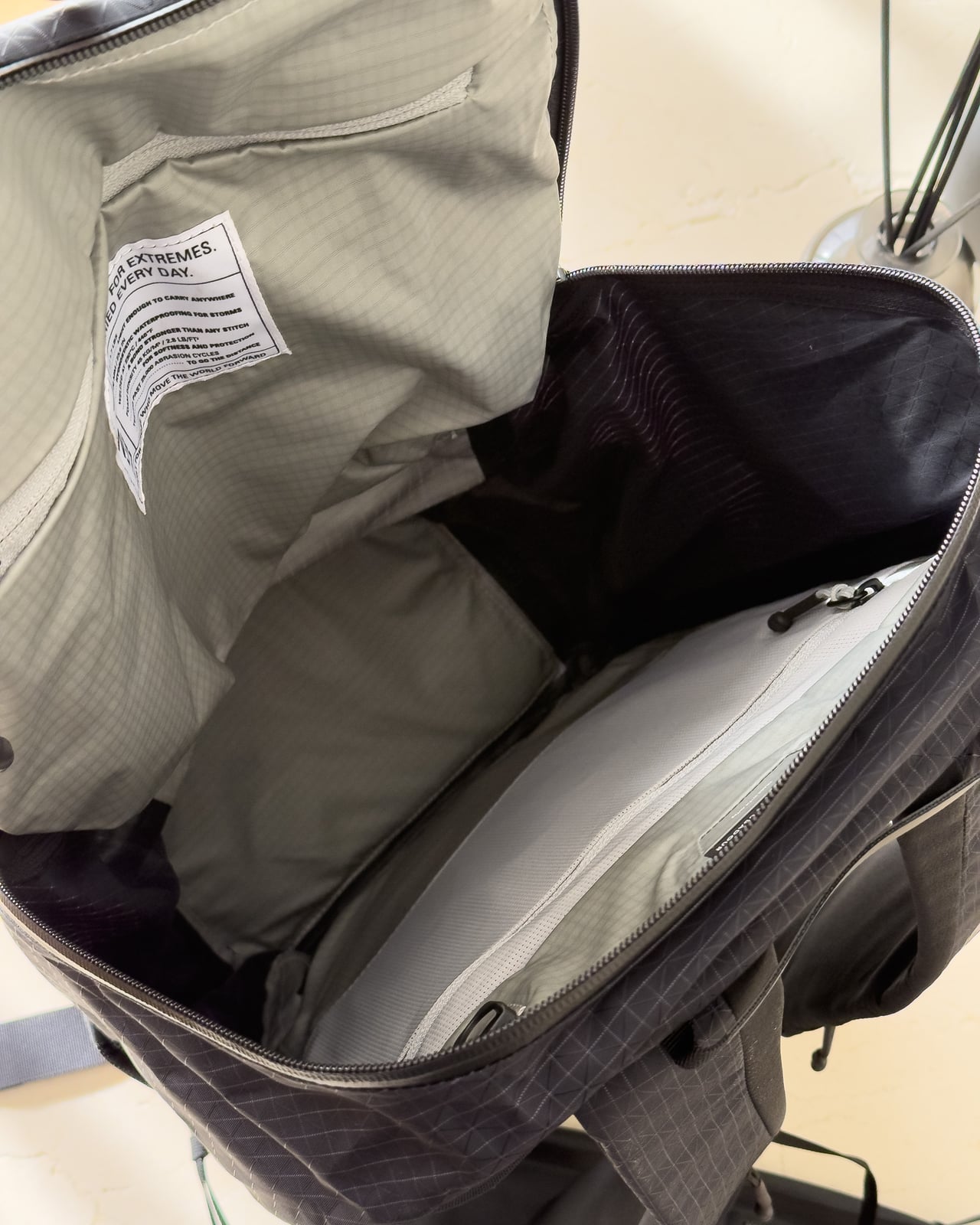 Interior compartments of the Troubadour Elemental Backpack, shown open - Luxe Digital