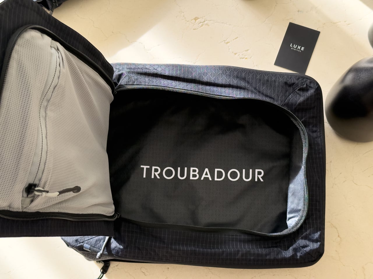 The Large Packing Dome expanded, fitting multiple shirts and sweatshirts - Luxe Digital