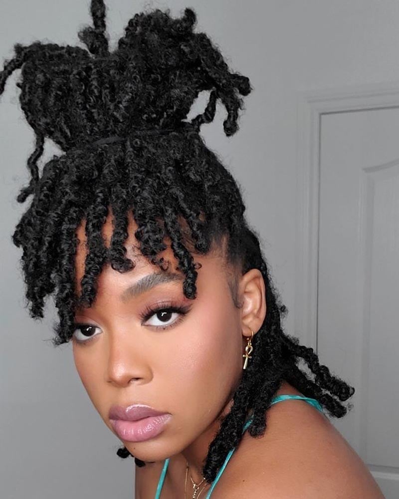 women dreadlock hairstyles high dreadlock bun with bangs - Luxe Digital