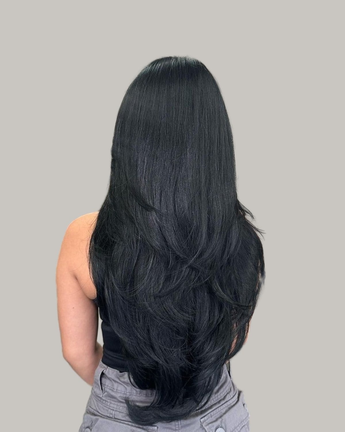 Long black layered hair seen from the back